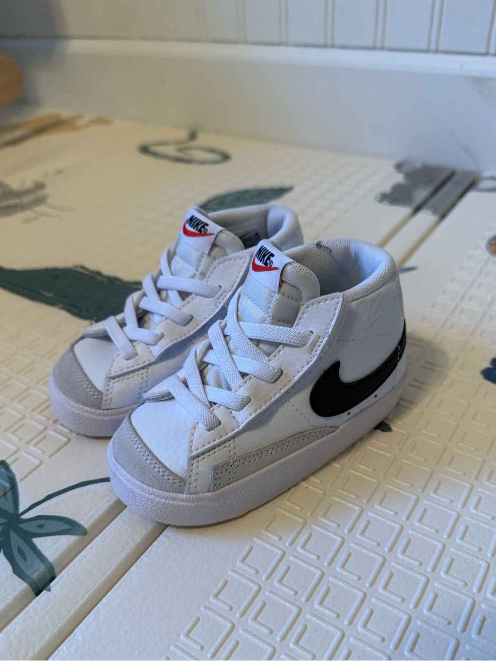 Nike Kids White Sneakers with Black Swoosh
